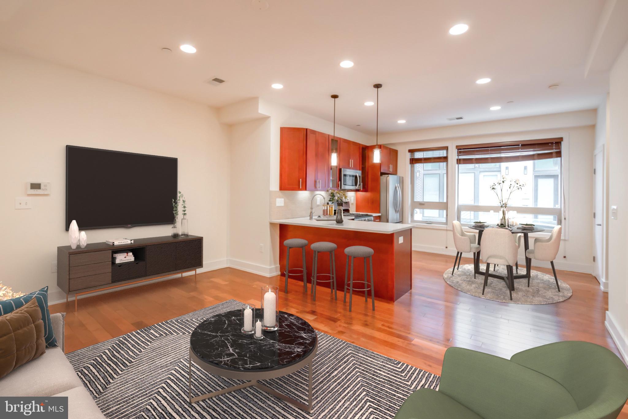 a living room with furniture a rug and a flat screen tv