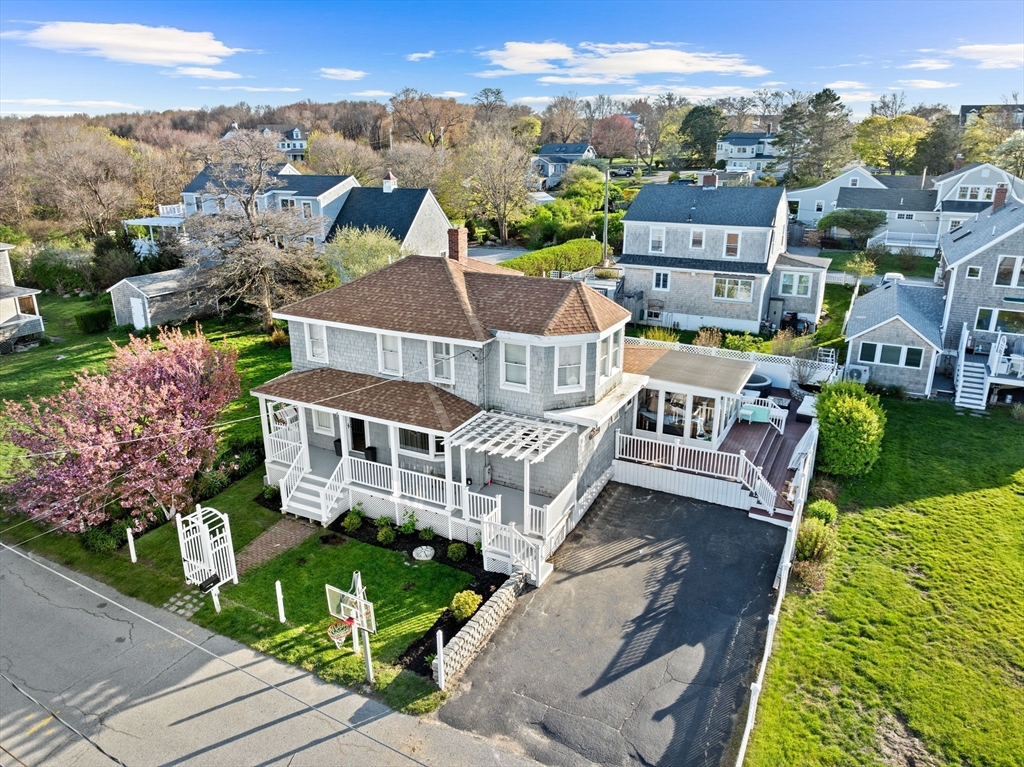 a aerial view of multiple houses with a yard