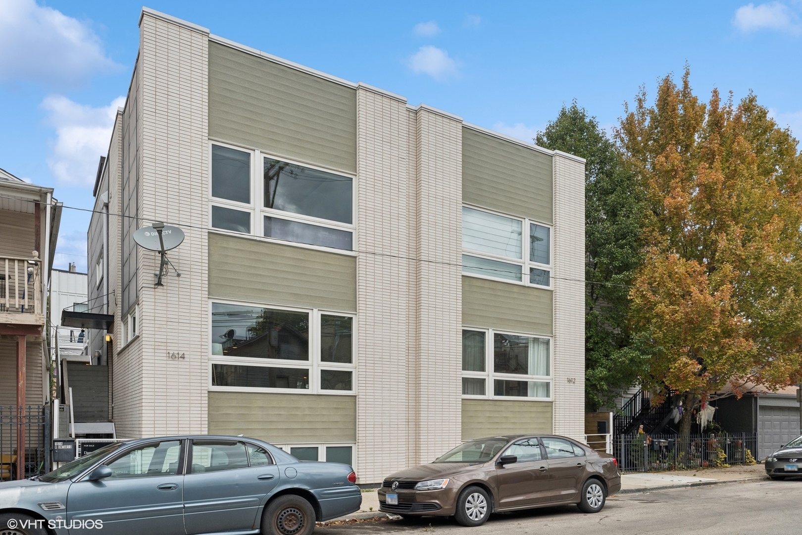 a front view of a building with parking space