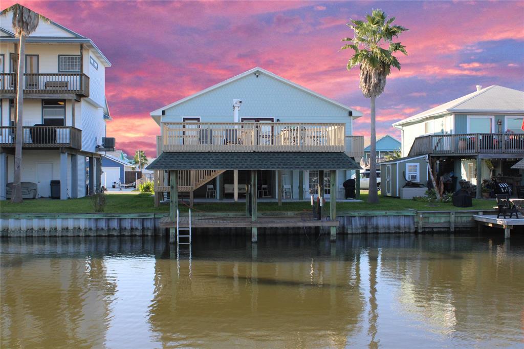 a front view of a house with a lake view