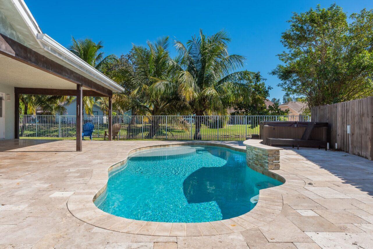 a view of a swimming pool with a sitting space