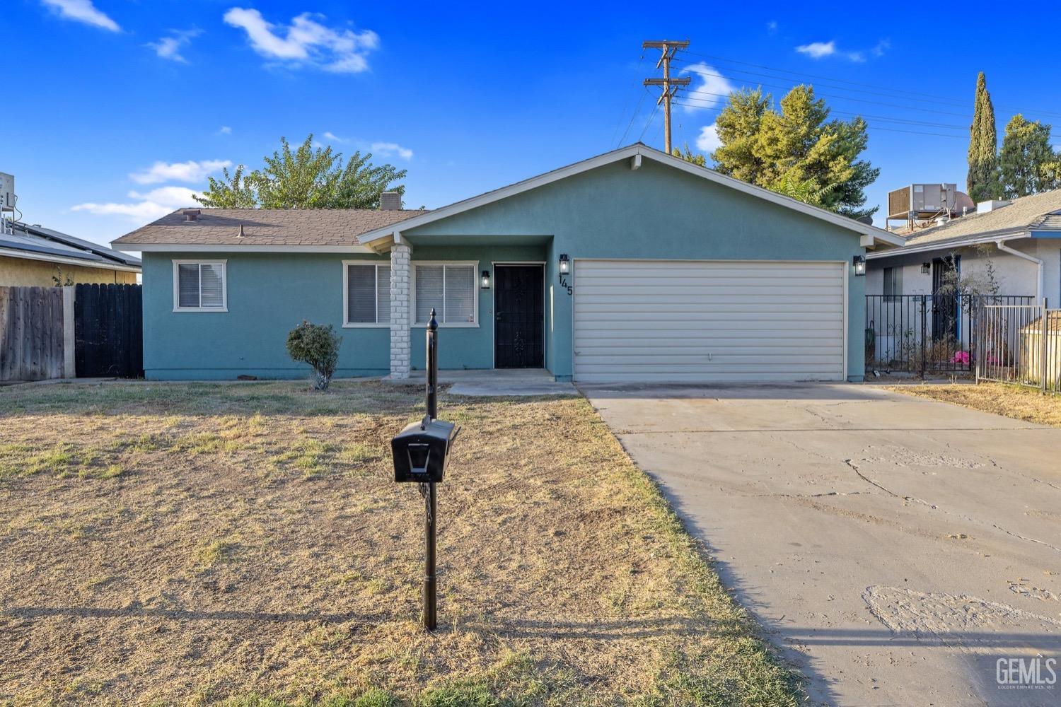 a front view of a house with yard