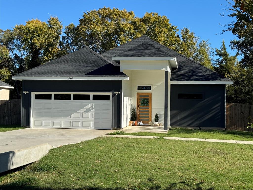 a front view of a house with yard