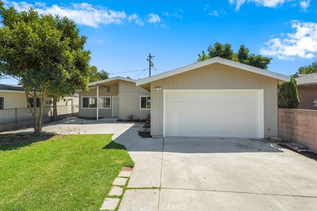 a view of a front of a house with a yard