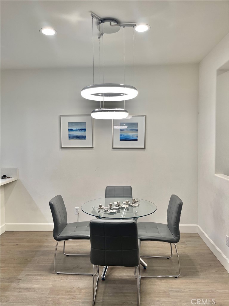 a view of a kitchen with a table and chairs