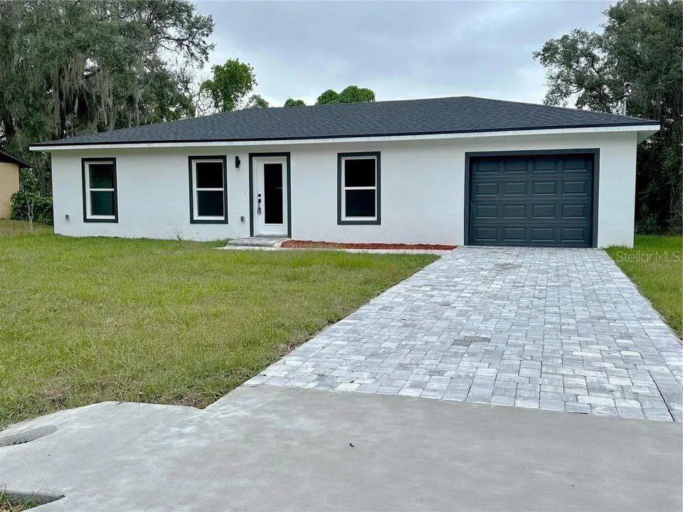 front view of a house with a yard