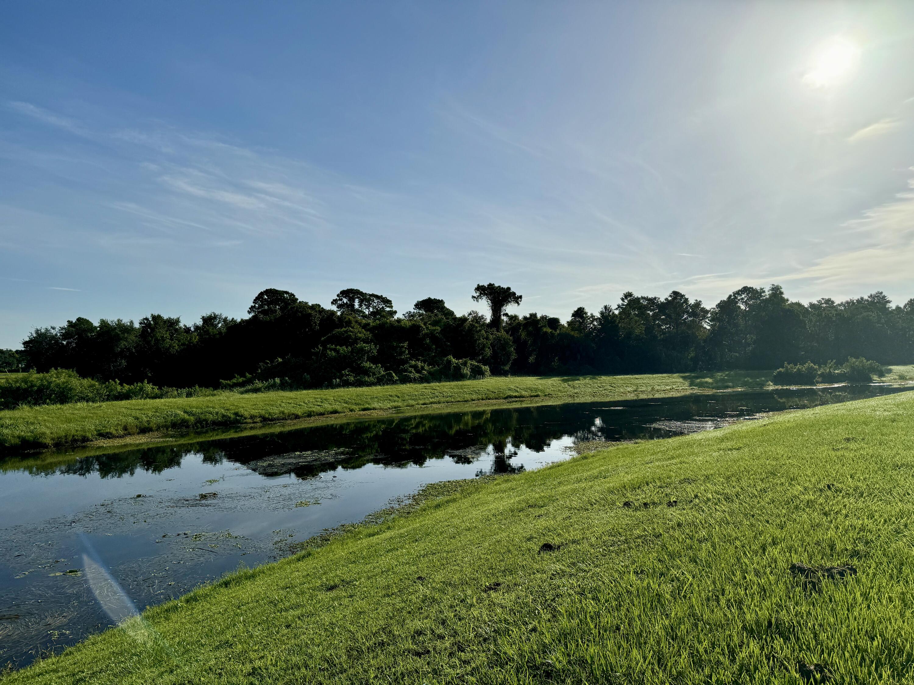 a view of a lake with a big yard