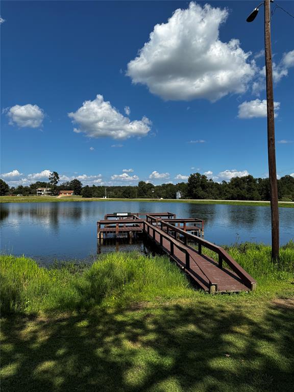 a view of a lake with houses in the back