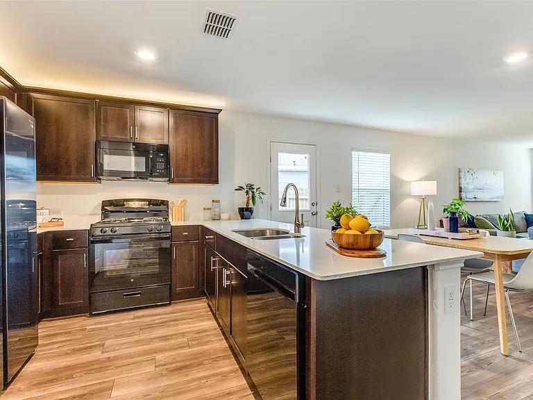 a kitchen with a sink and cabinets