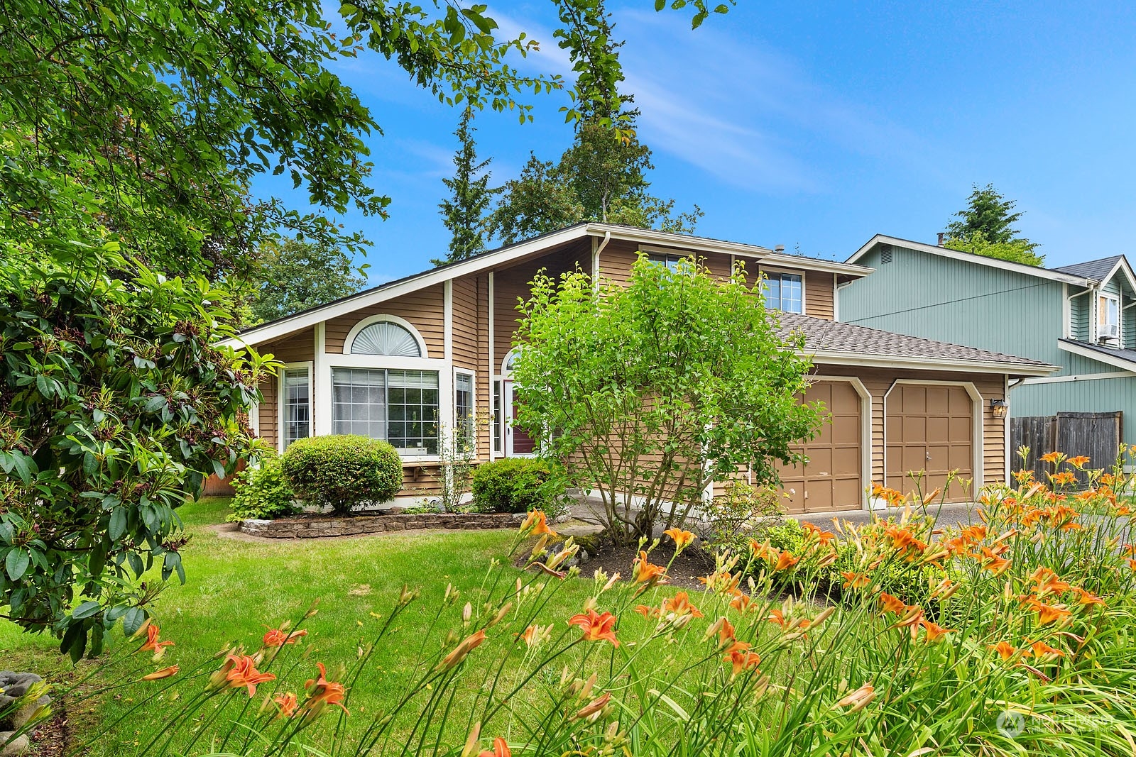 a front view of a house with a yard