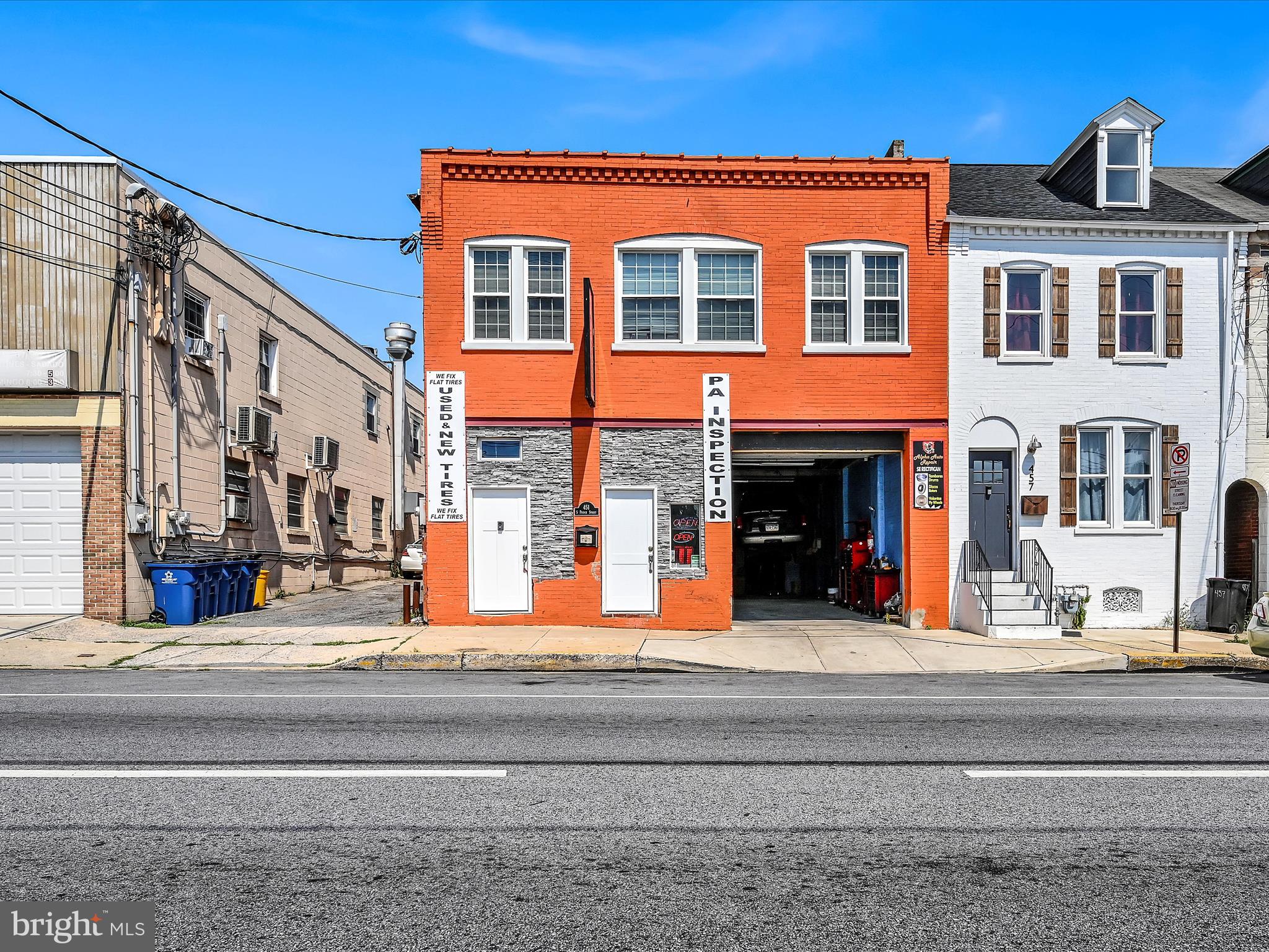 a front view of a building with street