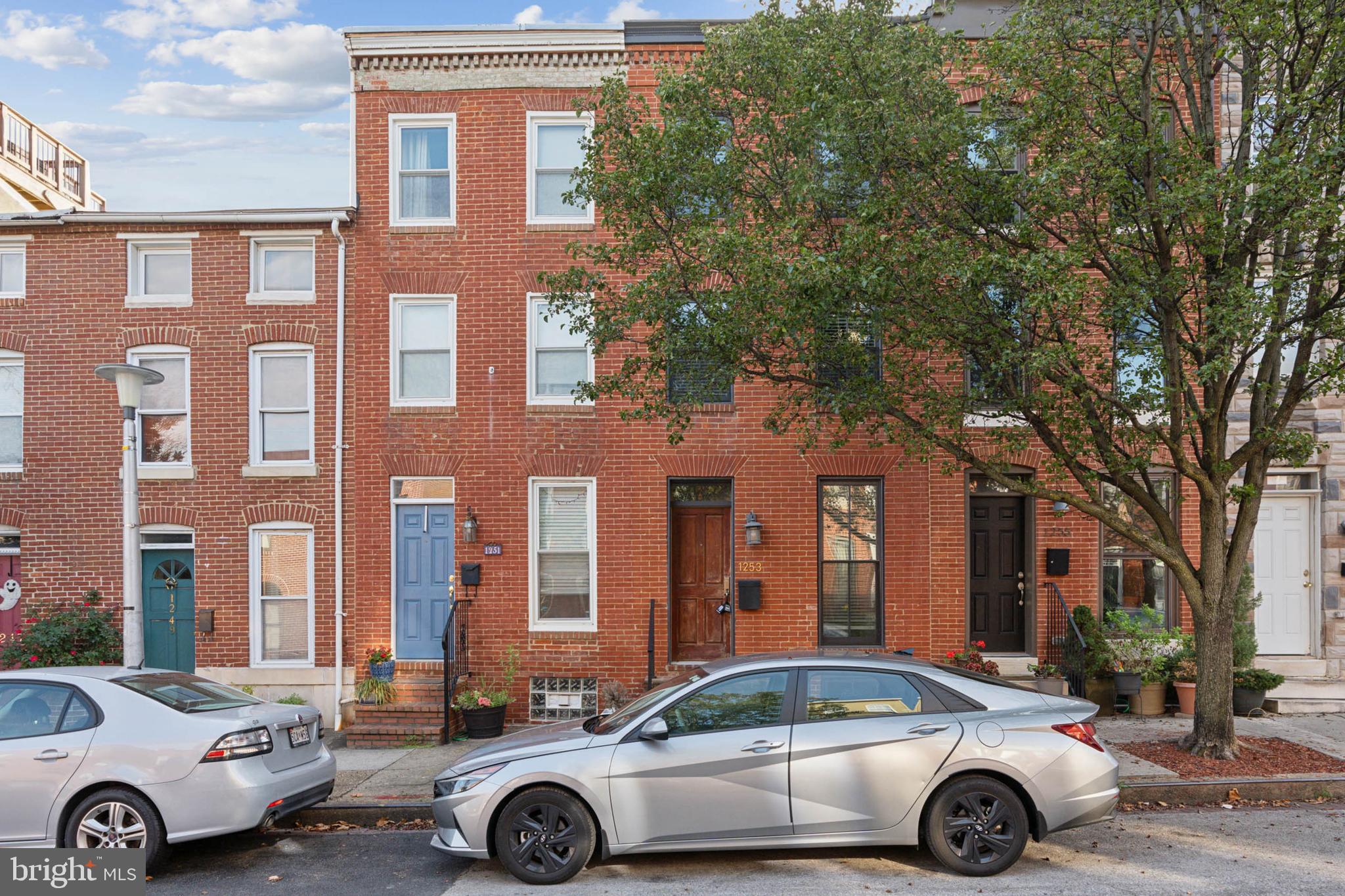 a front view of a house with parking space