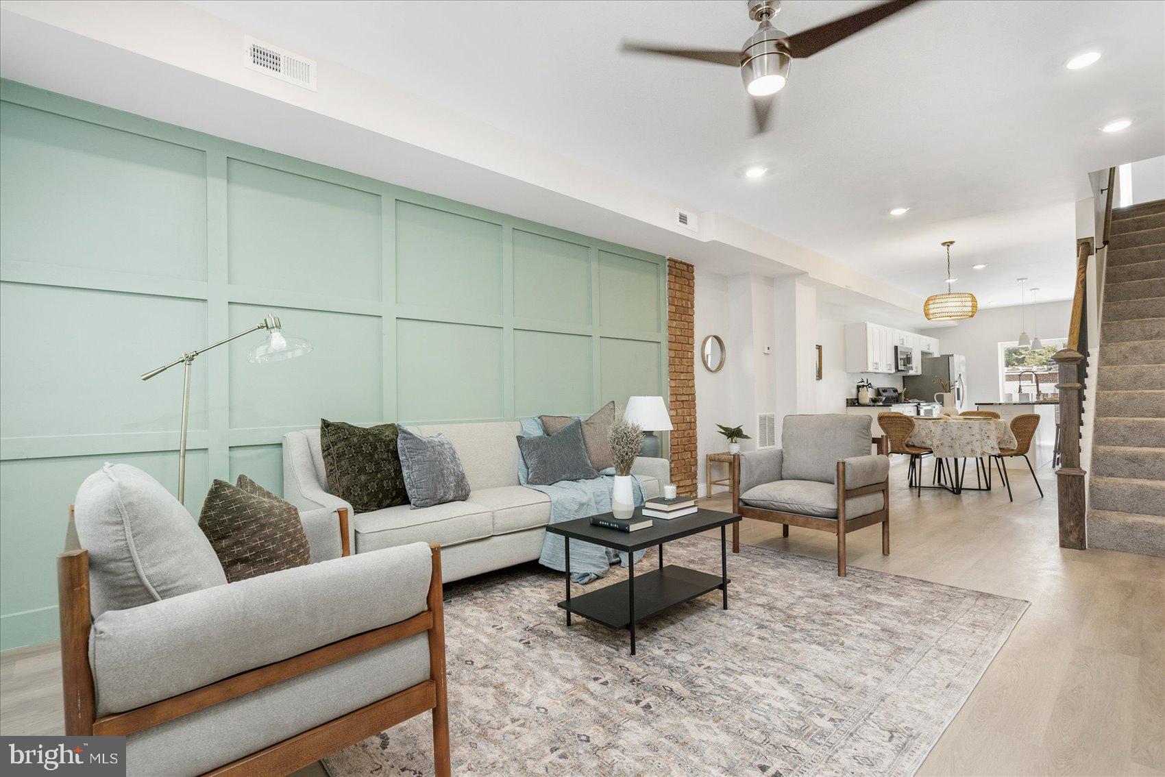 a living room with furniture and a rug