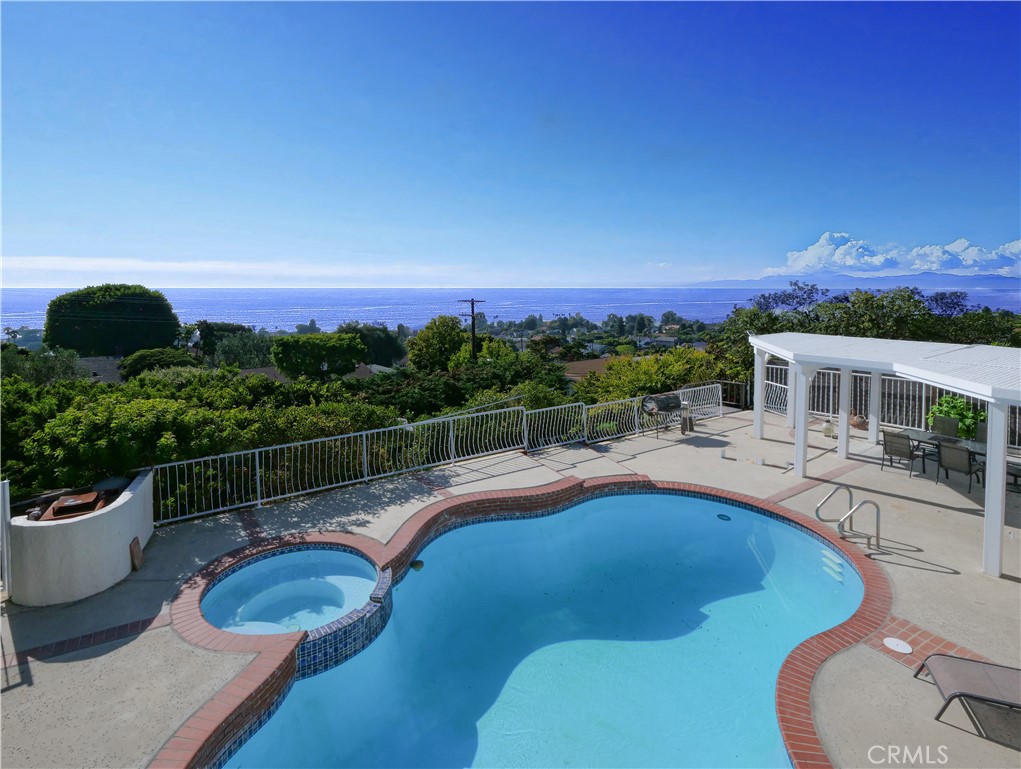 a view of a swimming pool with a patio