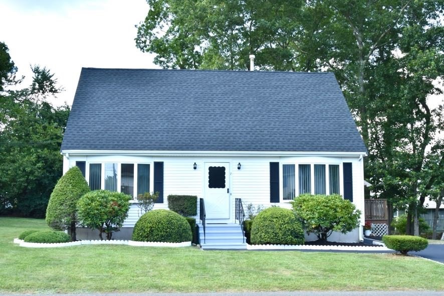 a front view of a house with a yard