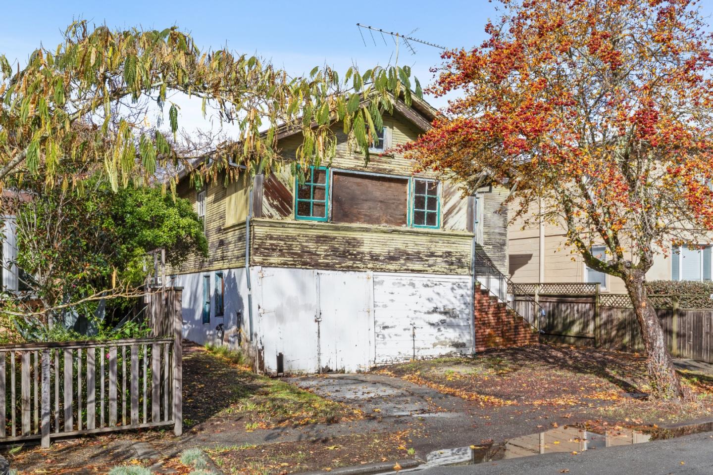 a view of a house with a tree