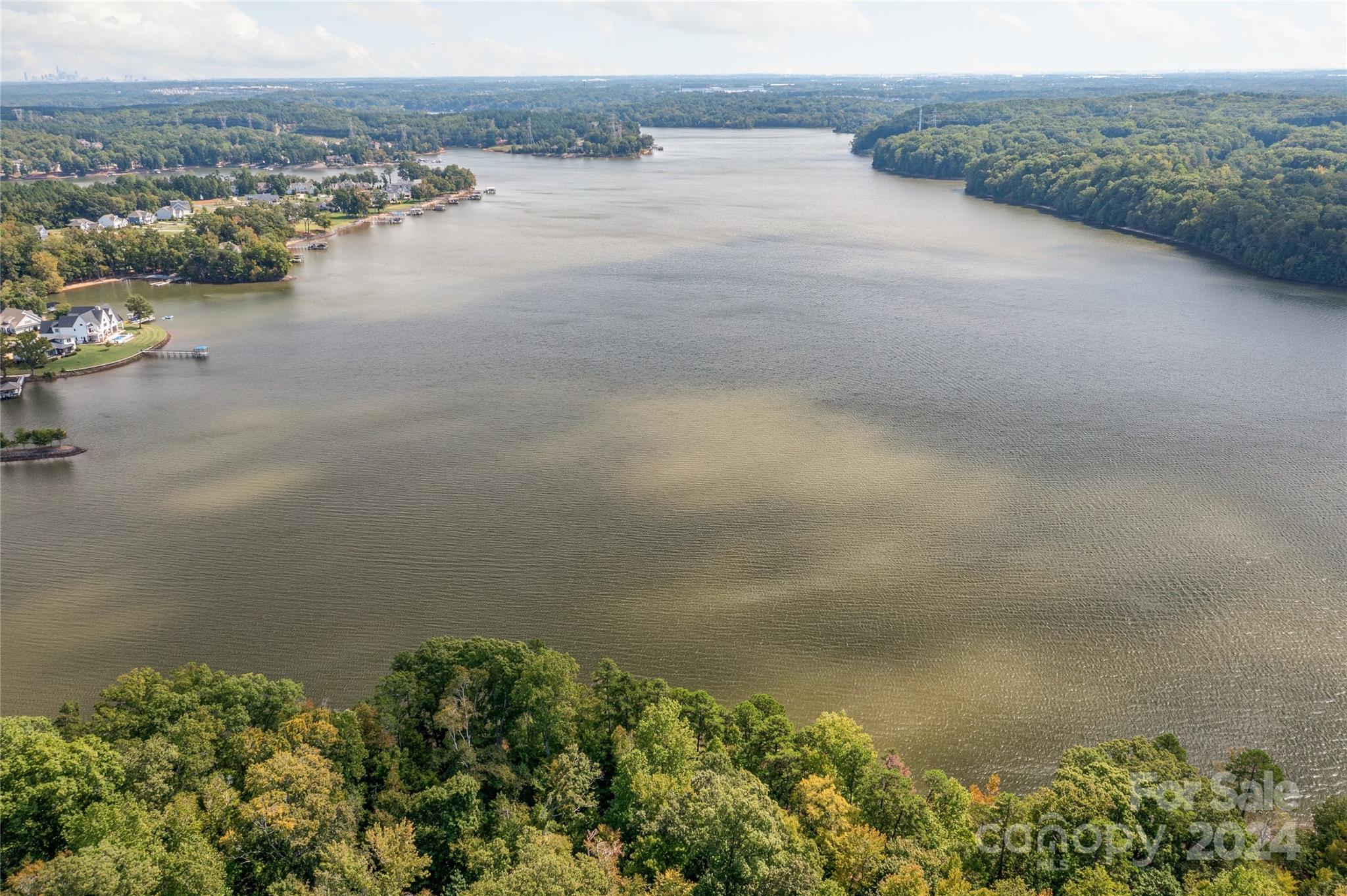 an aerial view of lake and mountain