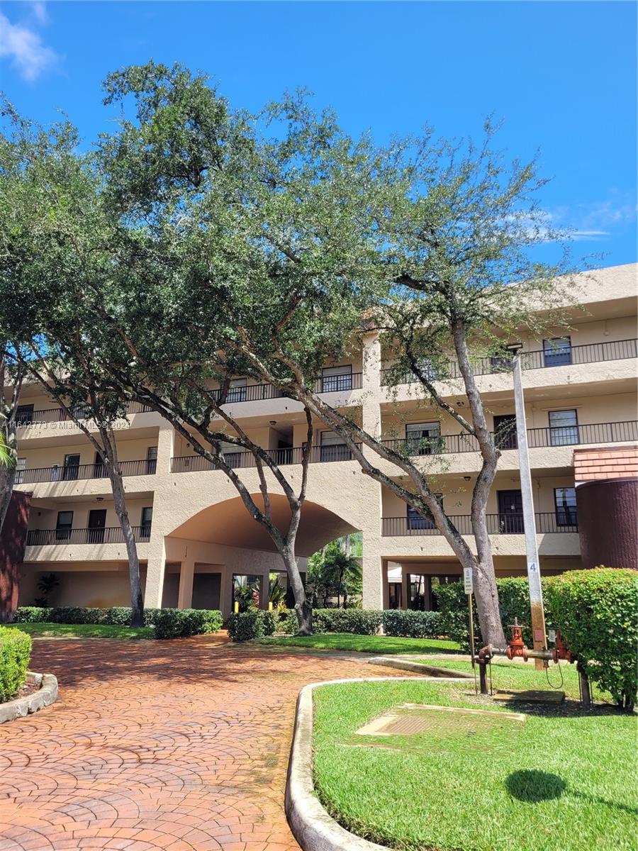 front view of a building with a yard