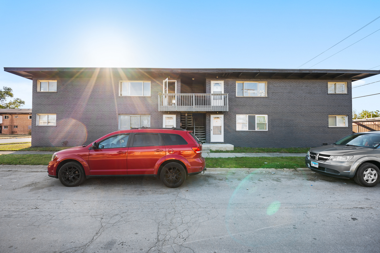 a front view of a house with parking space