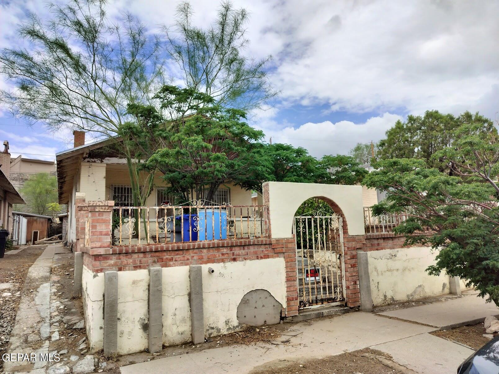 a view of front of a house with a garden