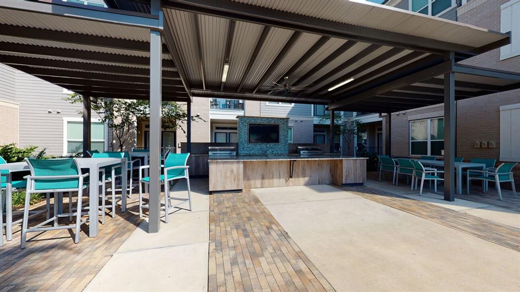 a view of a patio with a table and chairs