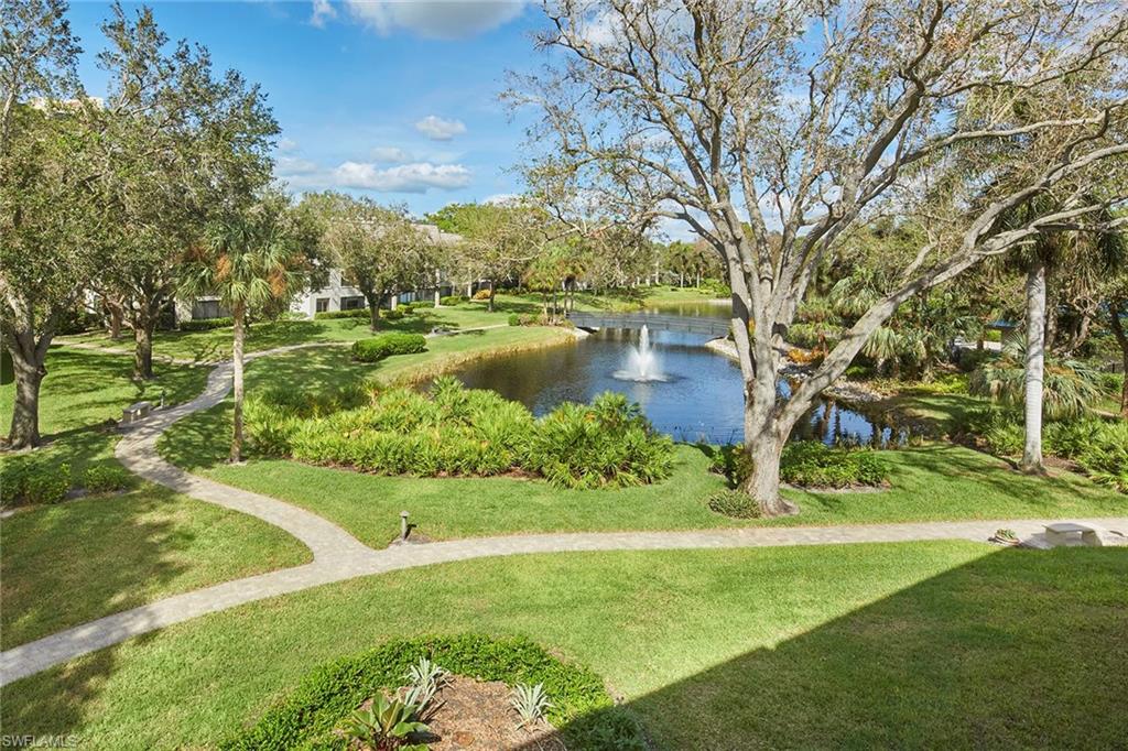 a view of a lake with a yard