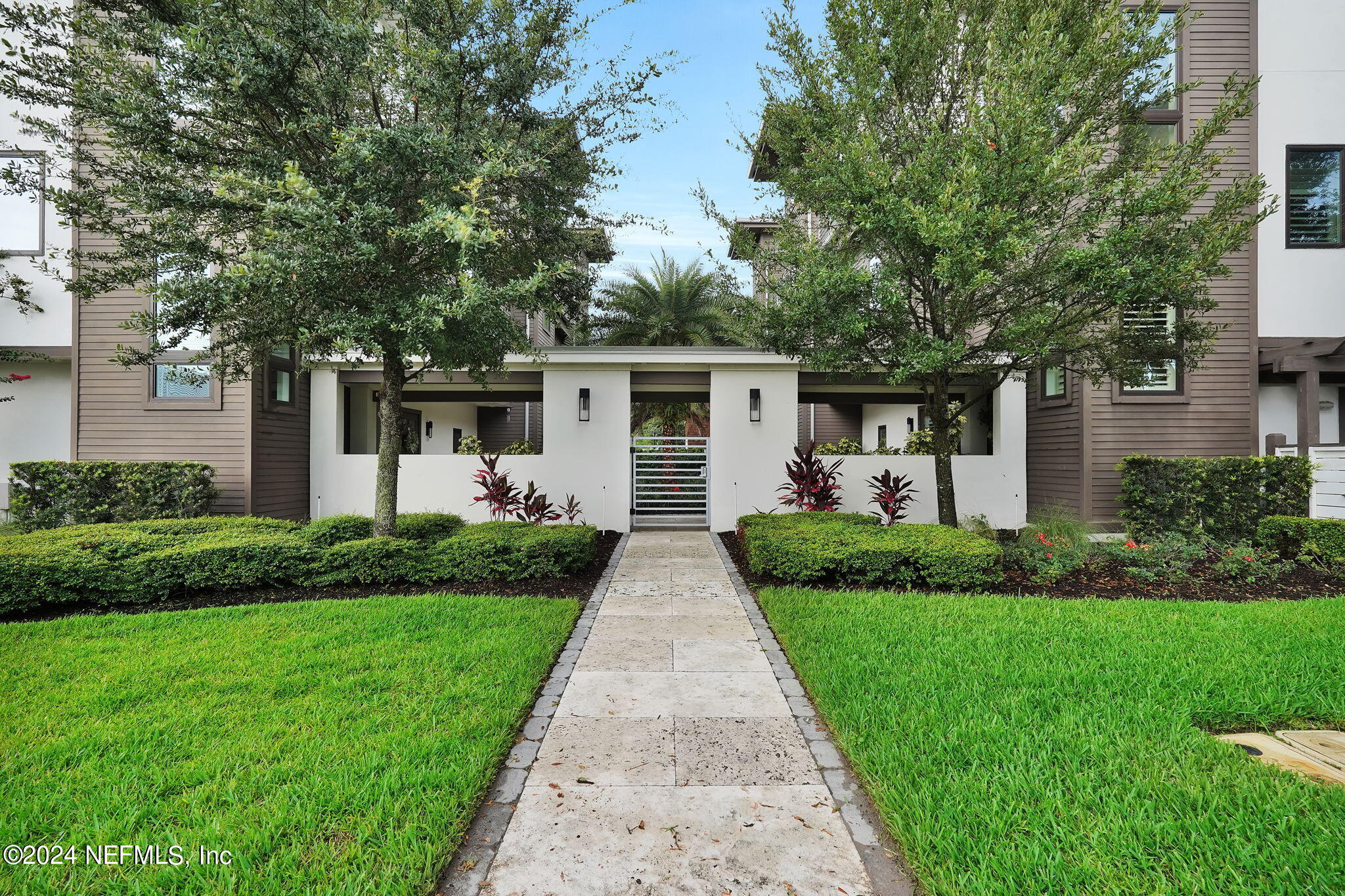 a front view of house with yard and green space