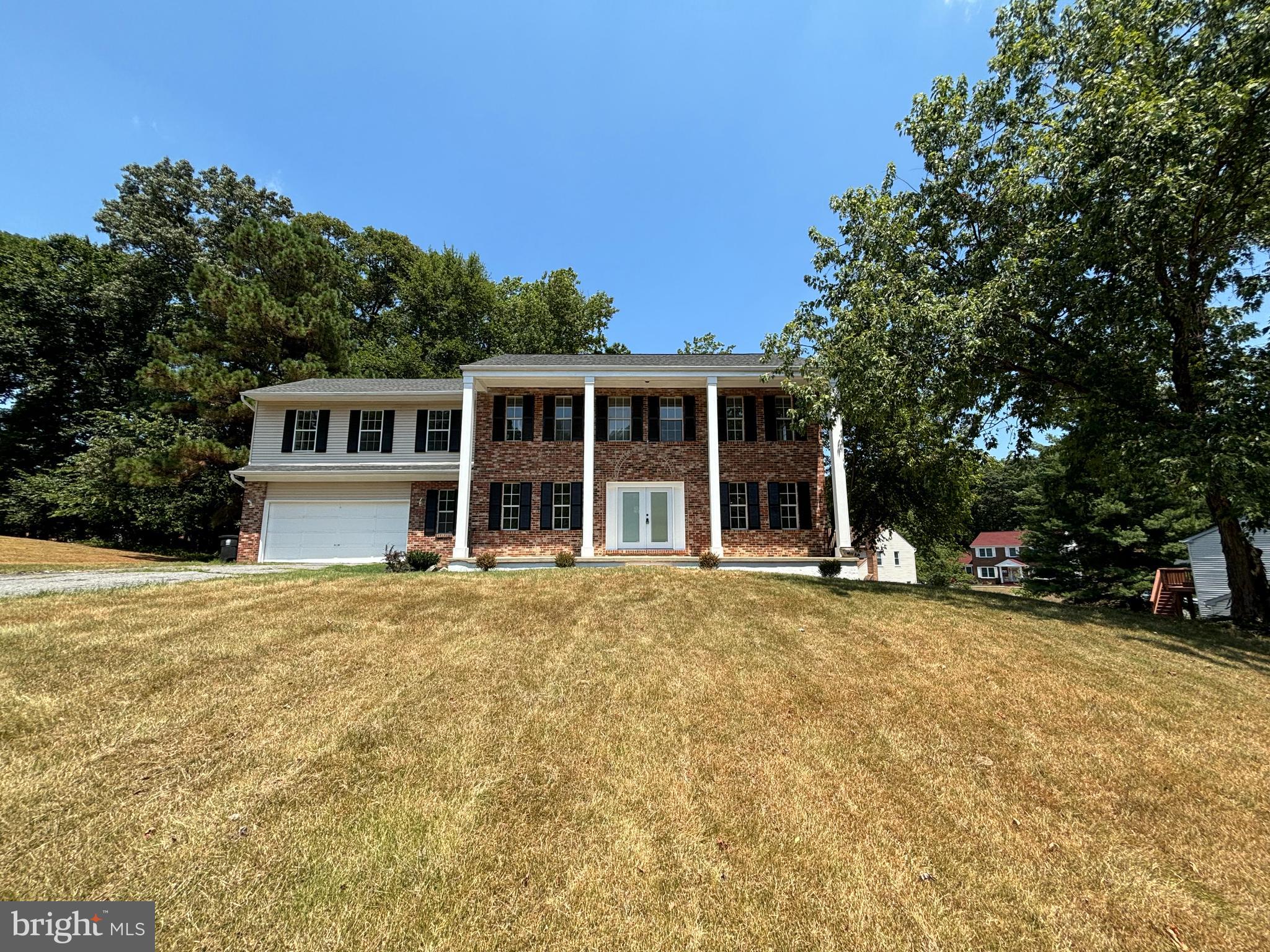 front view of a house with a garden