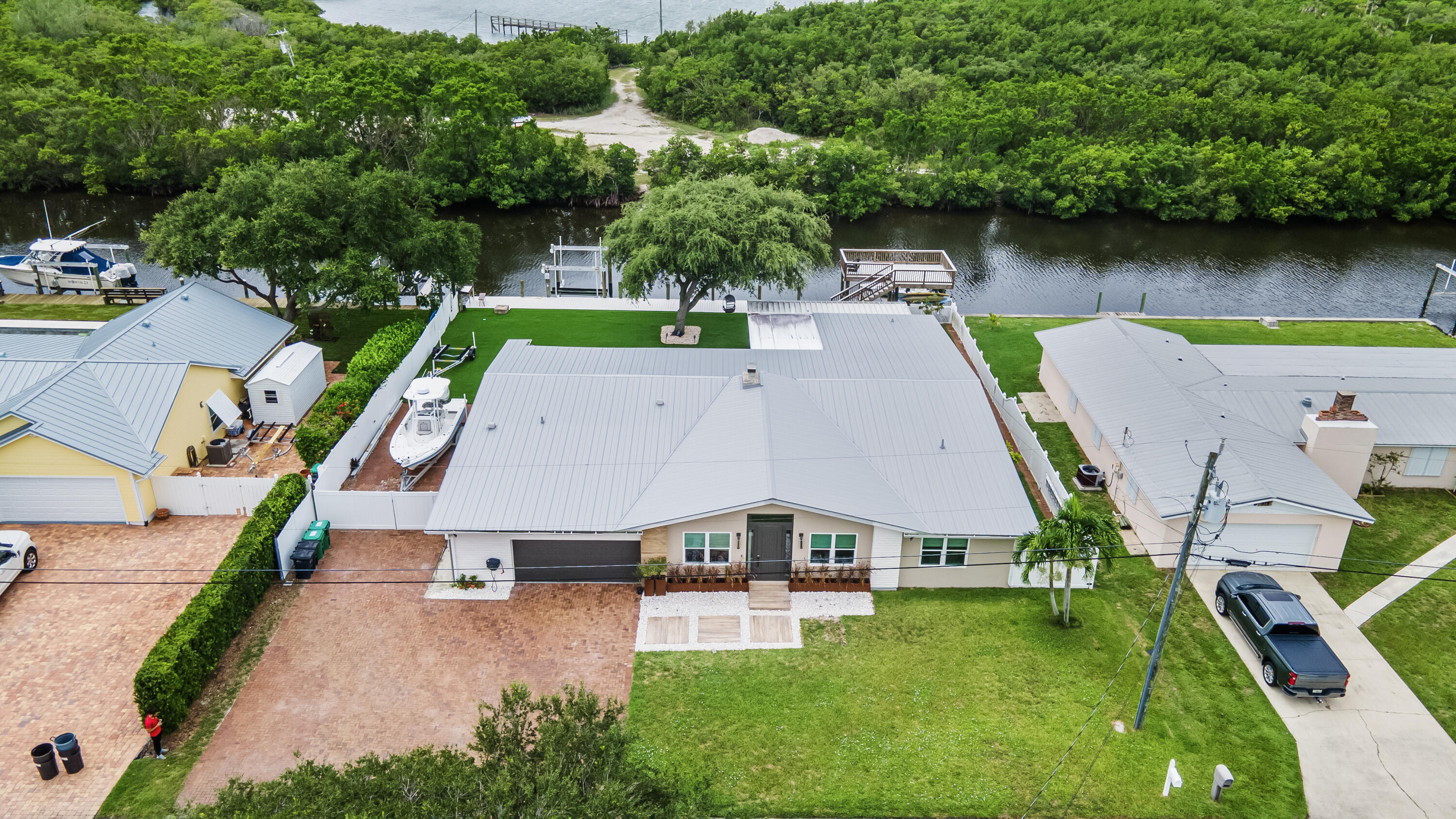 an aerial view of a house with swimming pool garden and patio