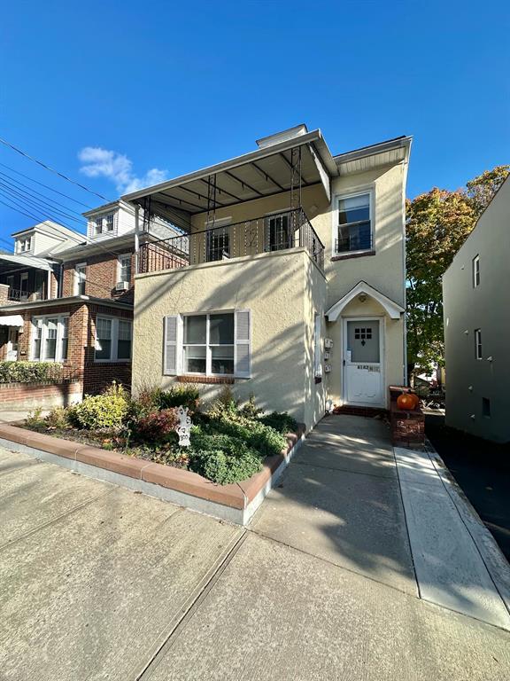 View of front of home with a balcony