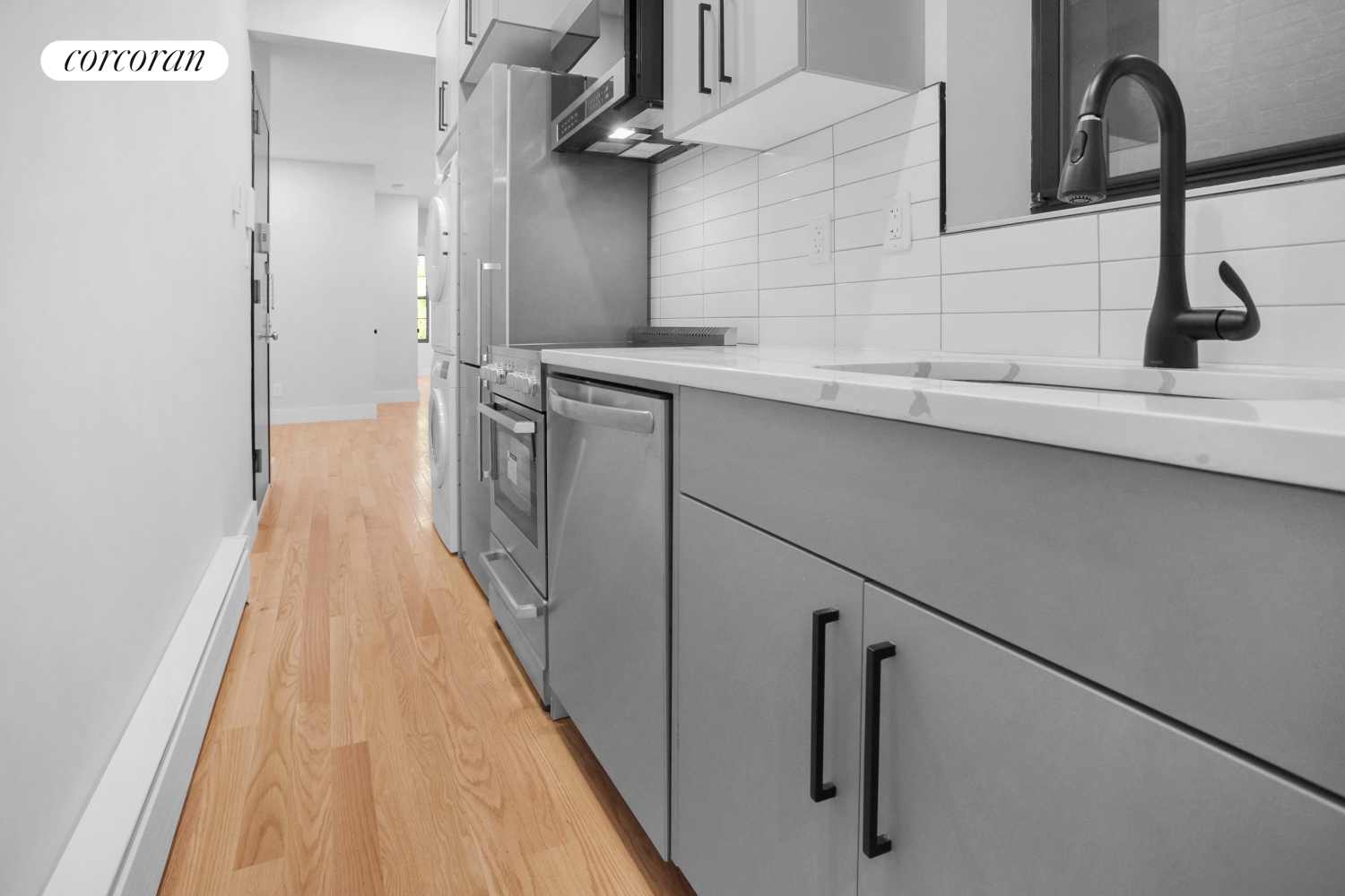 a kitchen with a sink and refrigerator