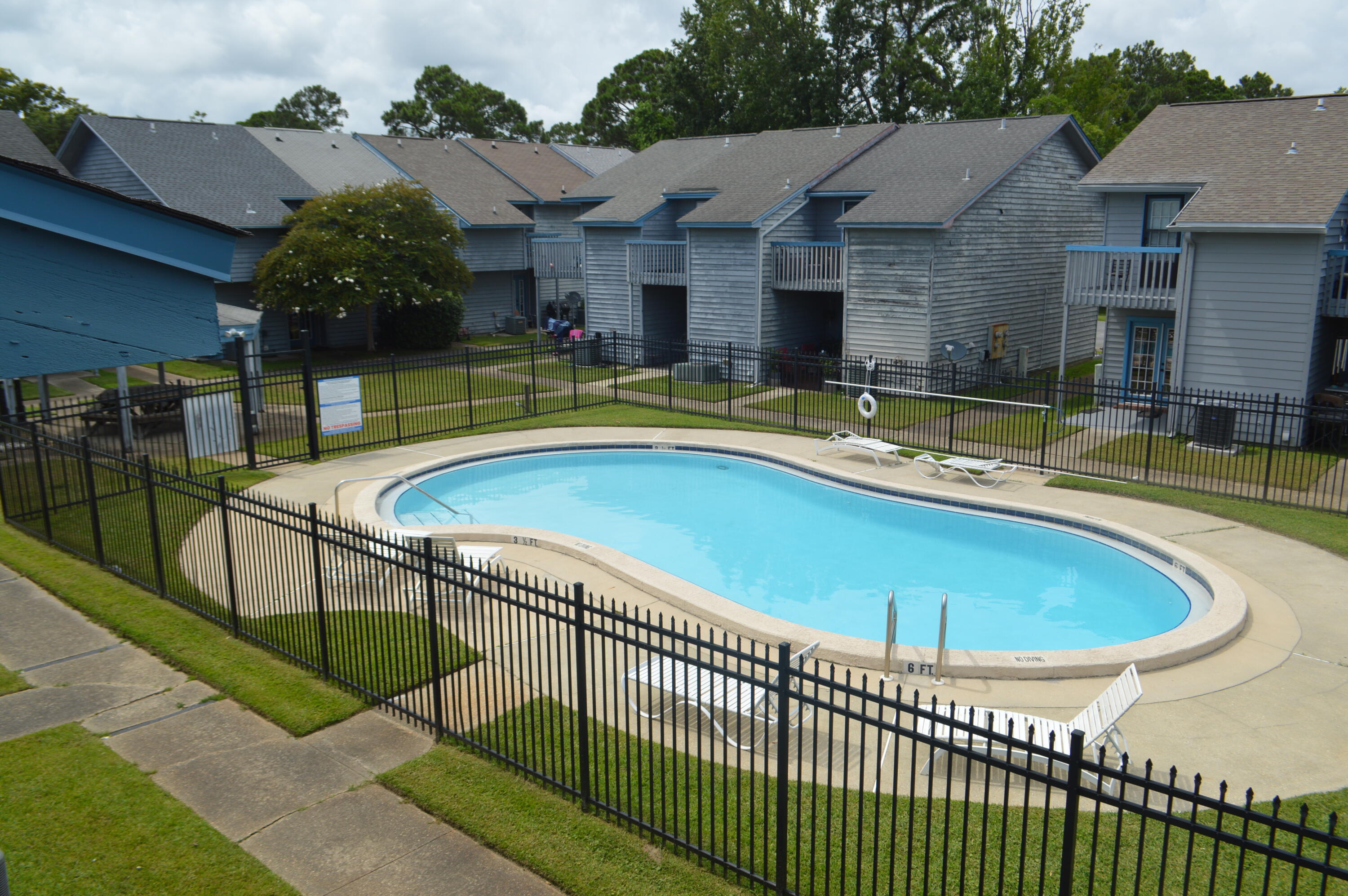 a view of a house with swimming pool