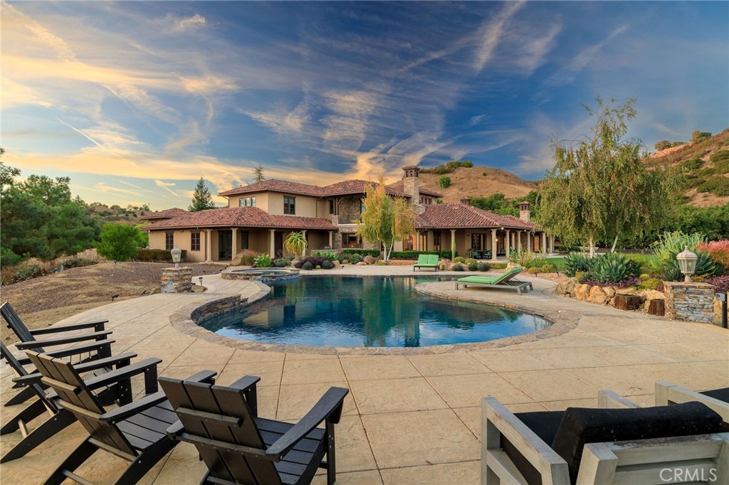 a front view of a house with swimming pool