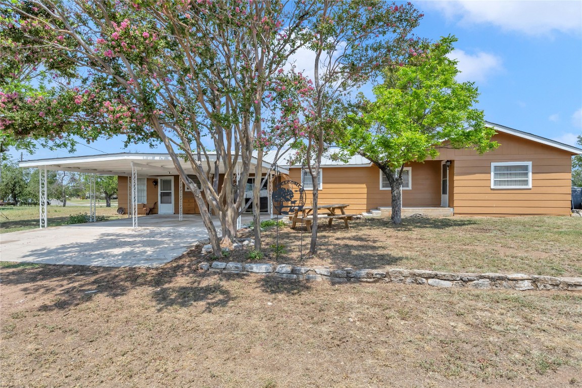 front view of a house with a tree