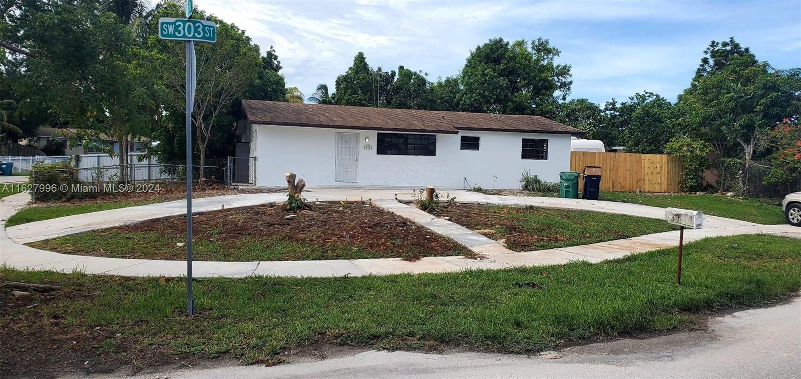 a view of a back yard of the house