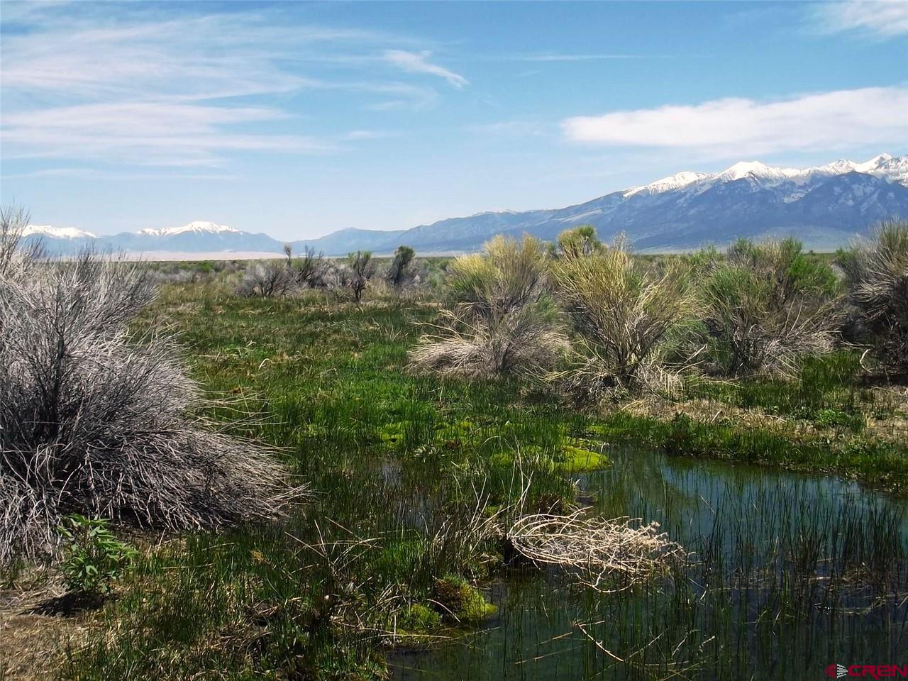 a view of a lake with a mountain in the background