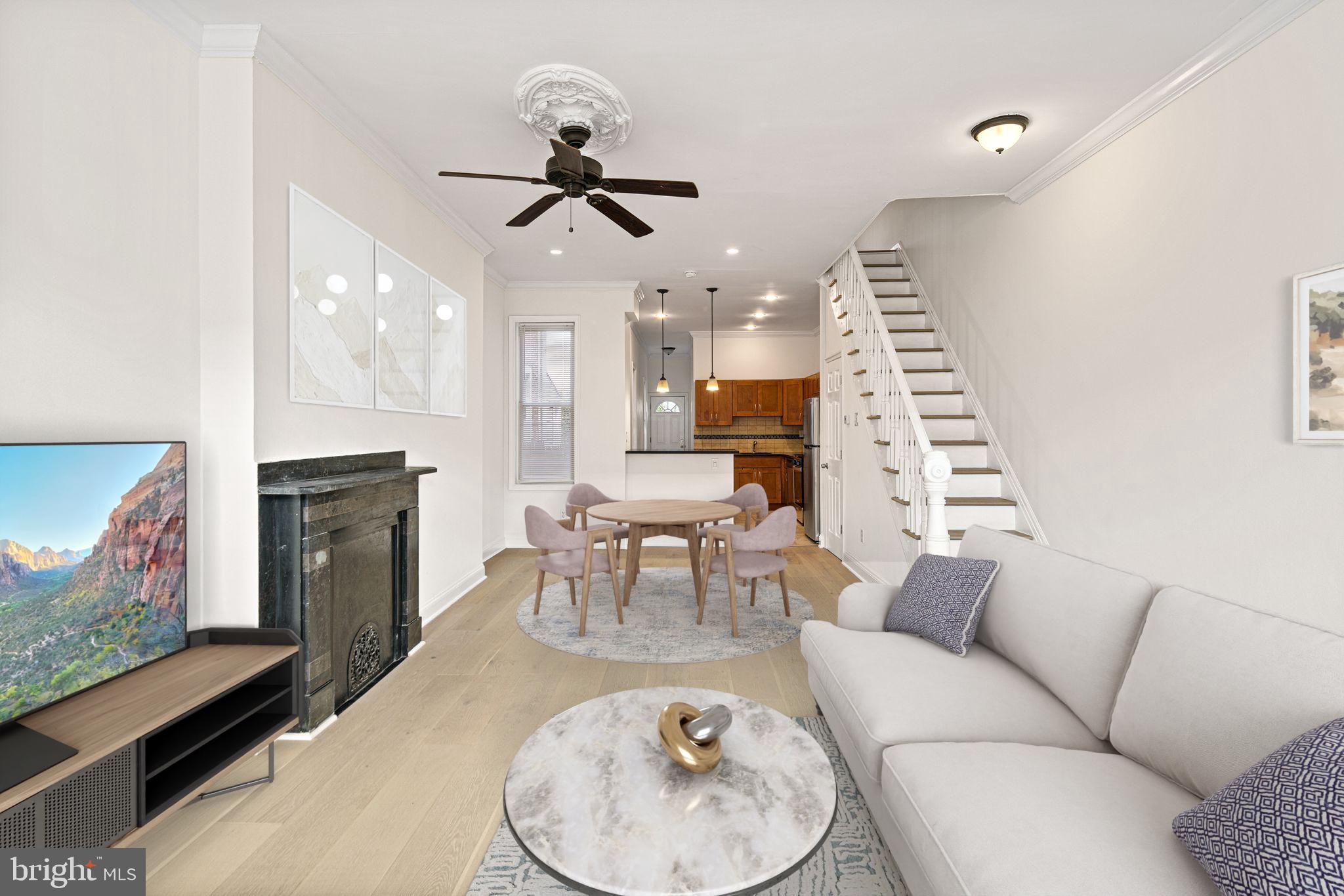 a living room with furniture a fireplace and a flat screen tv