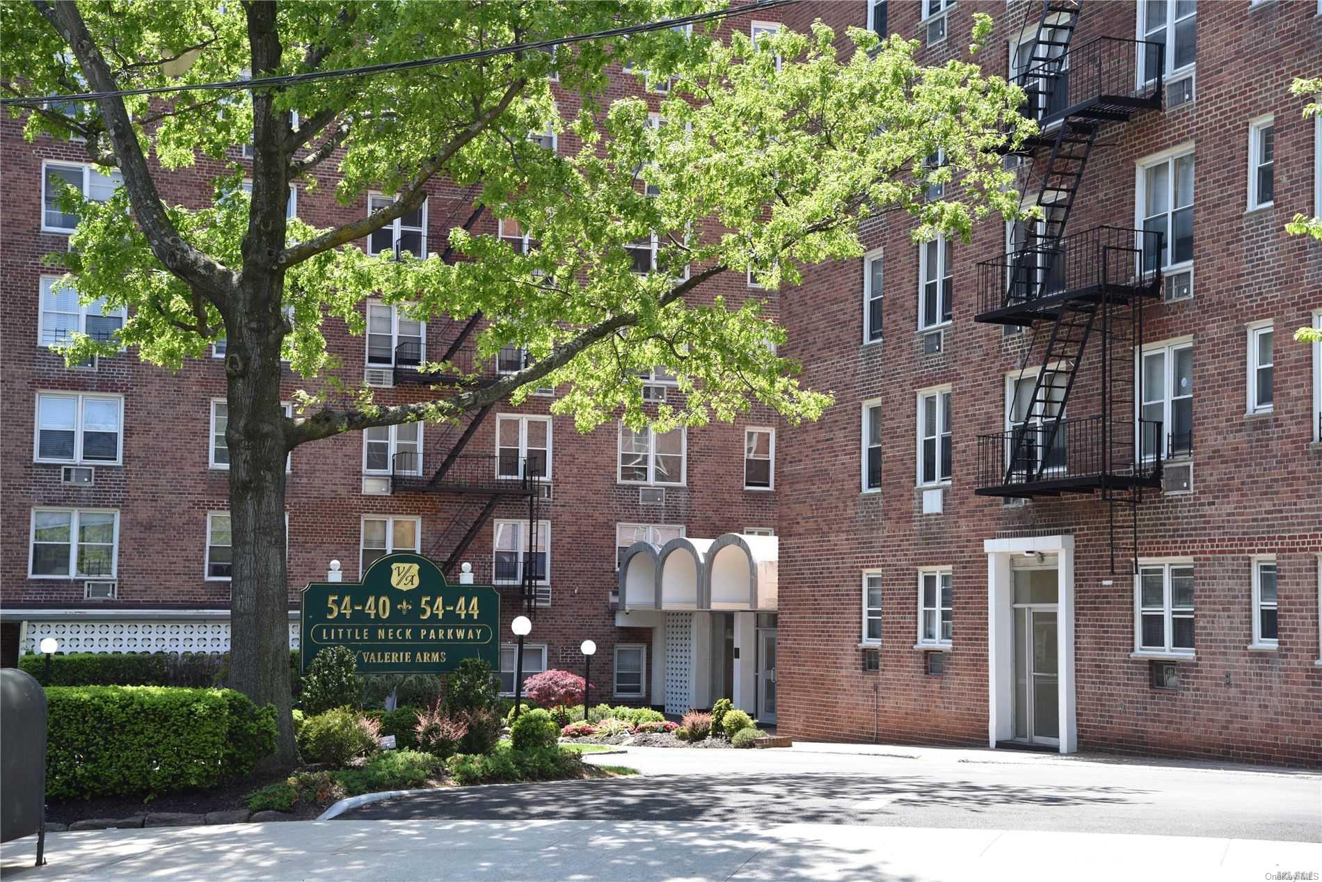 a front view of a building with street view