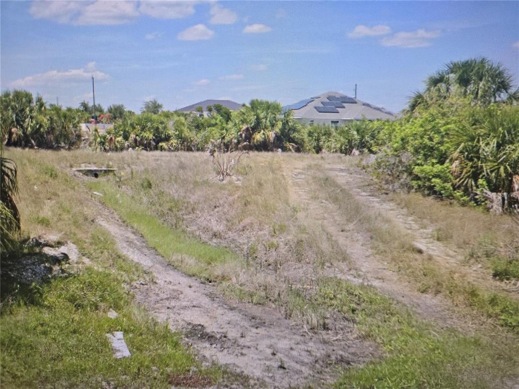 a view of a road with a building in the background