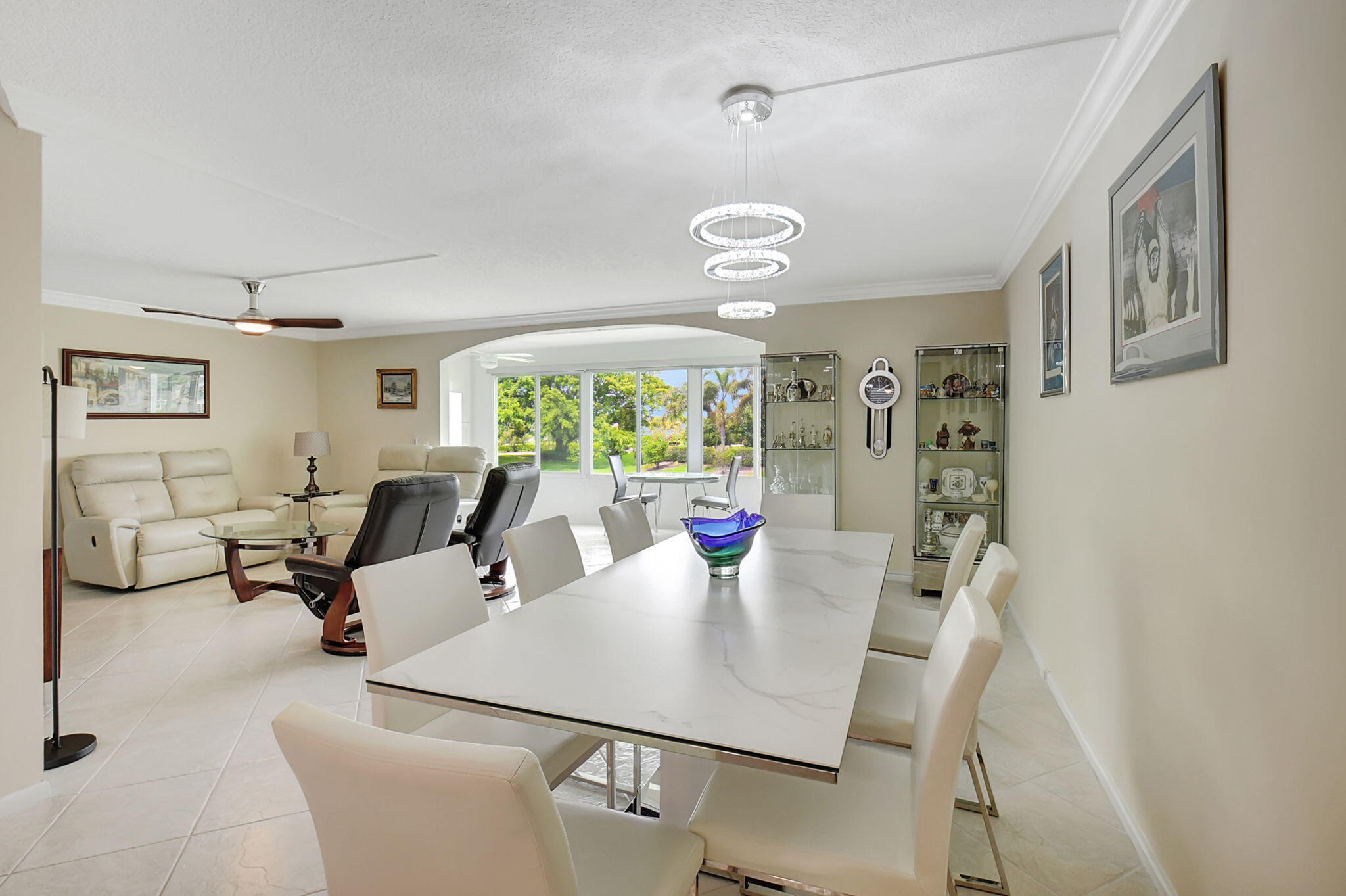 a view of a dining room with furniture wooden floor and chandelier