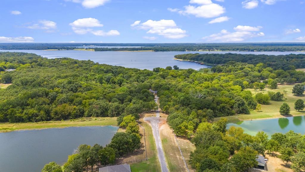 a view of a lake with a yard