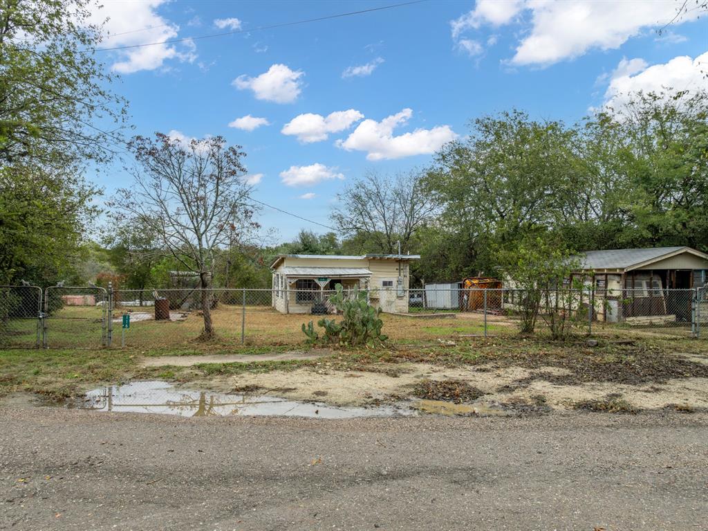 a view of a big yard next to a yard