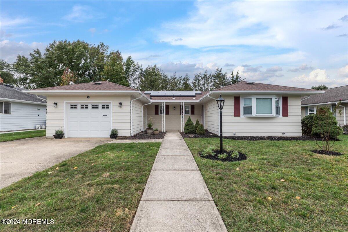 front view of a house with a yard