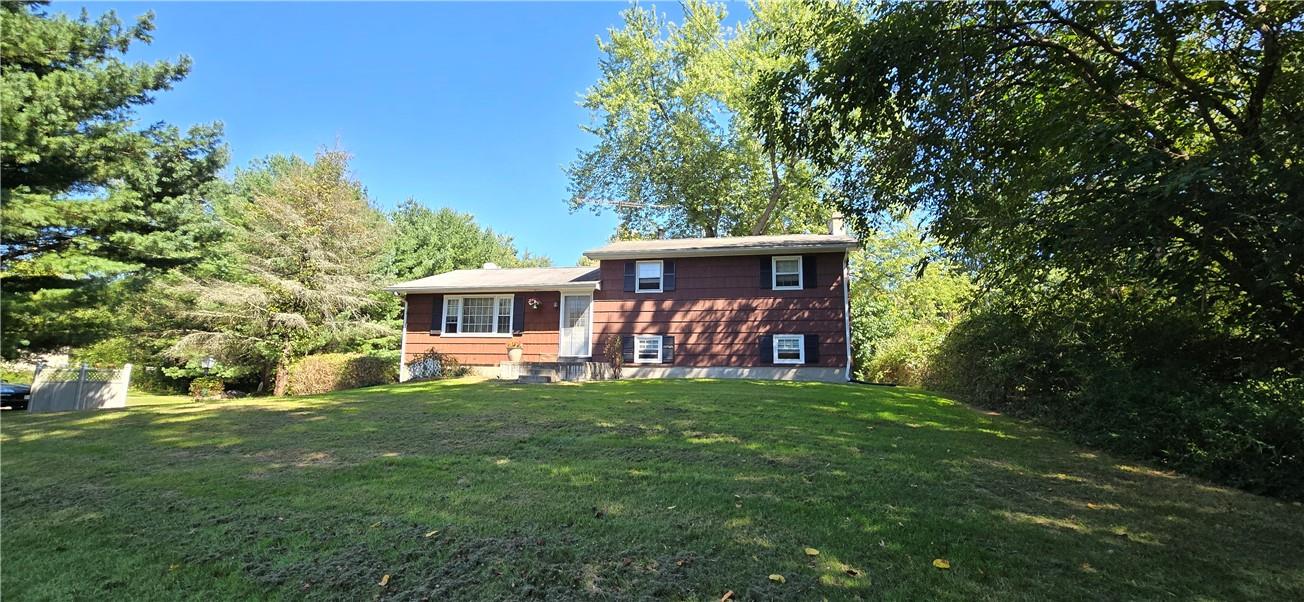 Front view of house featuring a lawn