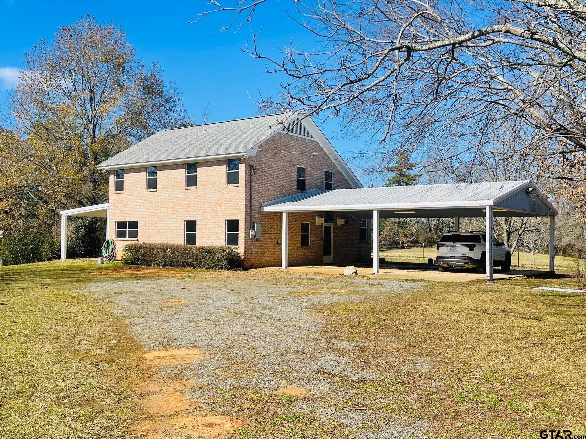 a house with yard in front of it