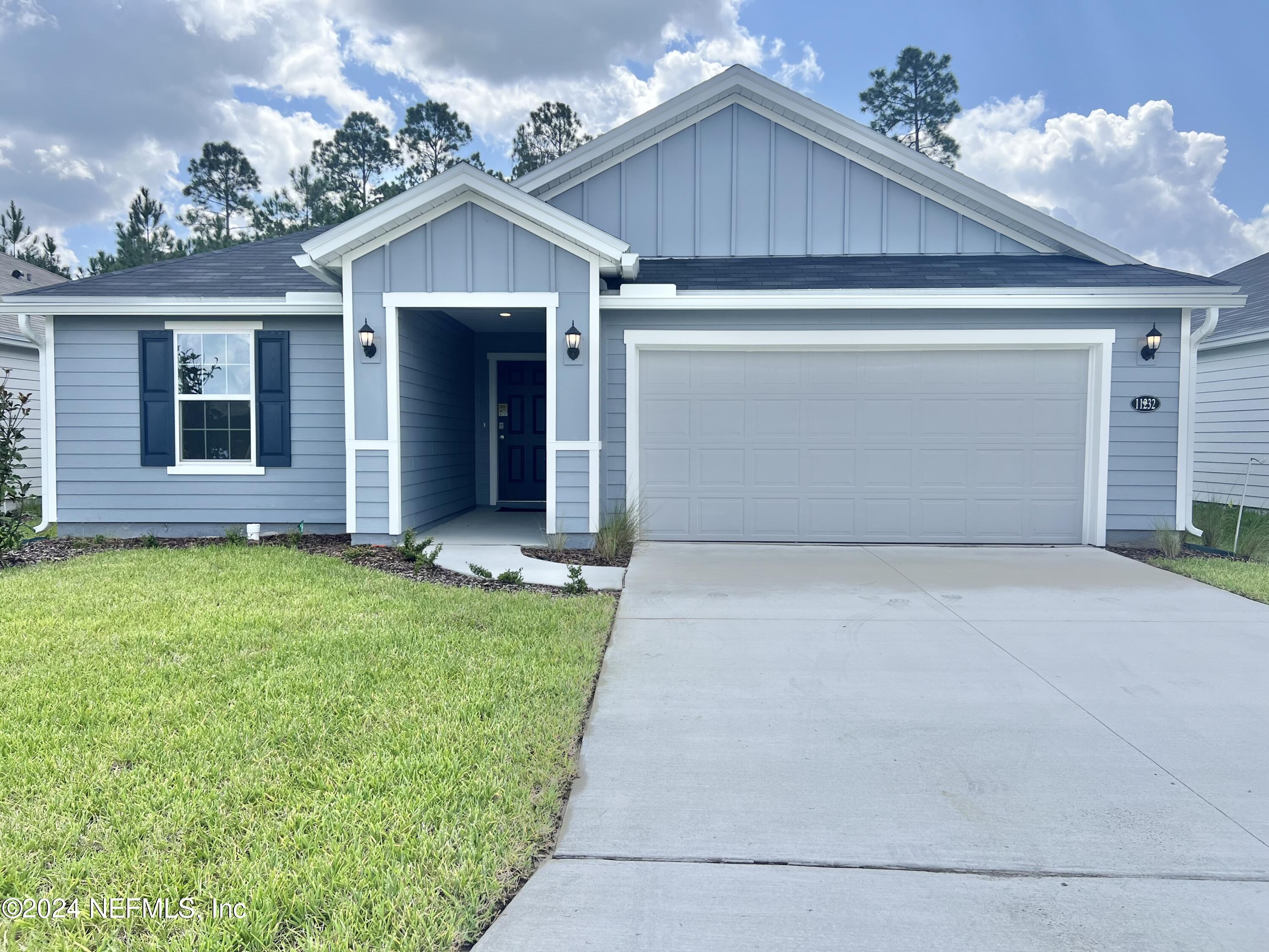 front view of a house with a yard