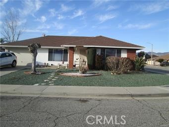 a front view of a house with a yard and a garage