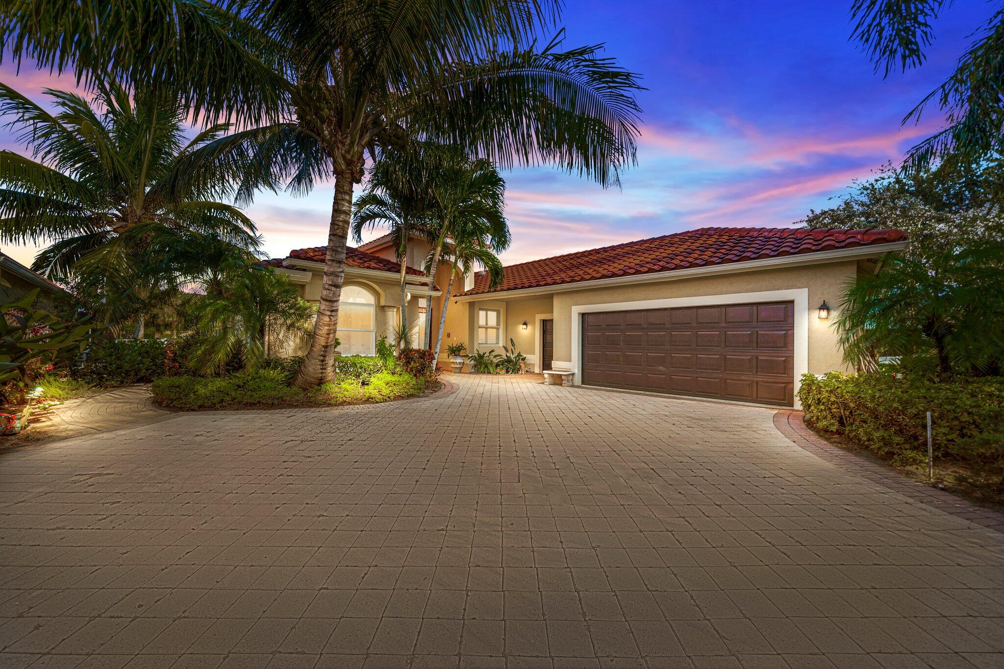 a house with palm tree in front of it