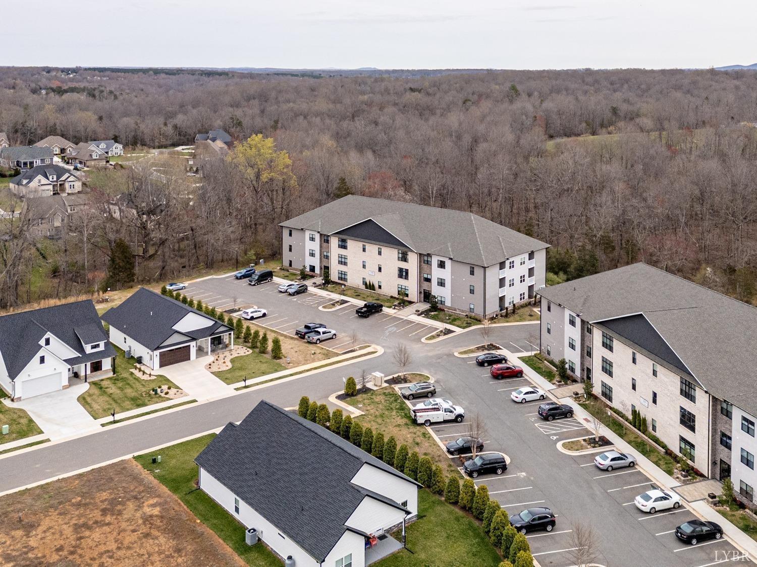 an aerial view of residential houses and outdoor space