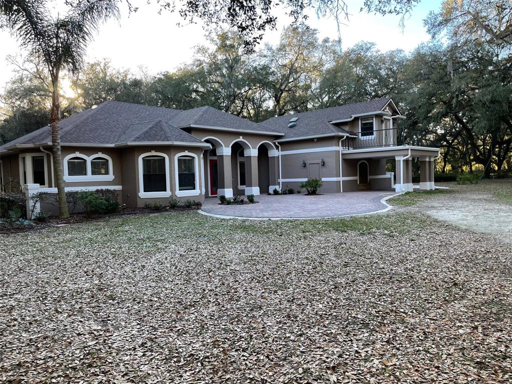 front view of a house with a yard